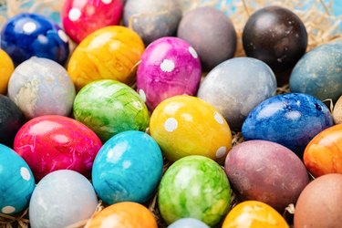 Colorful Easter eggs on straw