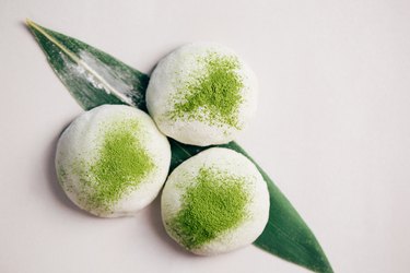 Three mochi desserts with matcha tea powder