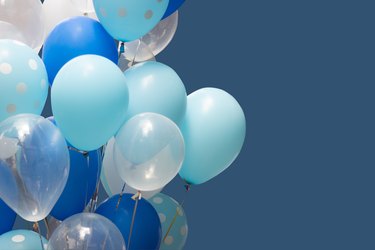 colorful balloons on blue background. happy new year and happy birthday concept