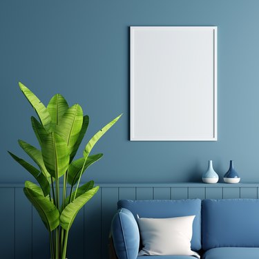Frame mockup in blue living room, 3D rendering