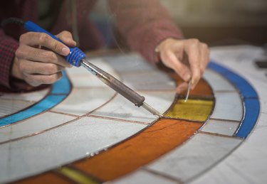 Student working on stained glass project.