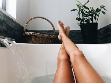 Woman Relaxing At Home In The Bathtub