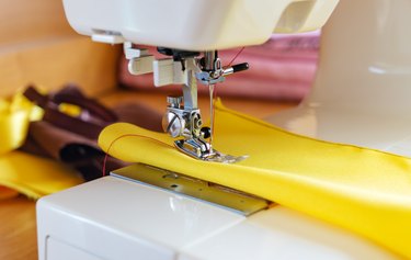 The sewing process on the sewing machine, close-up.