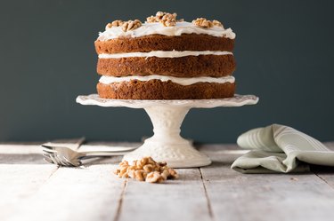 Carrot Cake On A Cake Stand With Cream Cheese Frosting