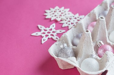Pink and silver glitter Christmas tree ornaments in egg packages