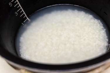 White rice grains soaking in water