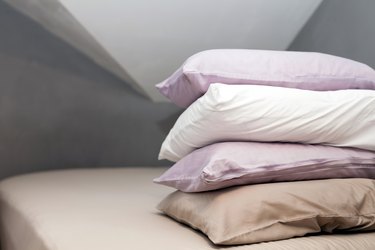 Pillows piled on a bed