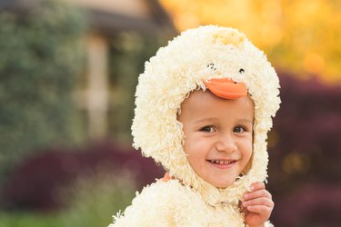 Boy dressed as yellow duck goes trick or treating