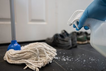 Black slate floor is cleaned with bleach spray