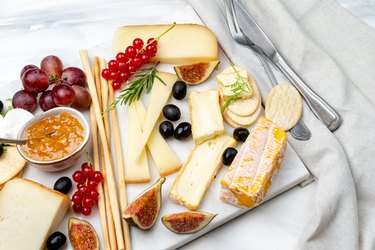 Сheese plate with berries and crackers