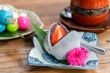 Japanese traditional sweet dessert daifuku, made from glutinous rice with fresh strawberry and red bean paste