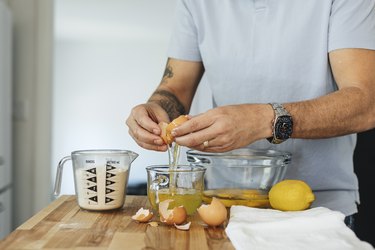 Man cracking an egg into a bowl