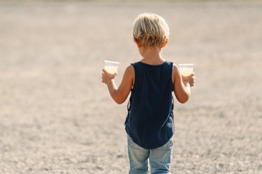 Little girl carries lemonade