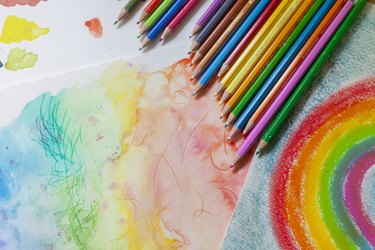 Colorful background with different spots and strokes of colored pencils