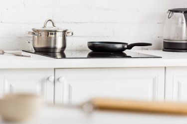 Selective focus stainless saucepan black,Close-up of kitchen utensils on stove in kitchen at home