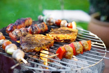 Skewer and meat on grill
