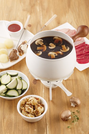 Chinese fondue with vegetables, mushrooms and meat