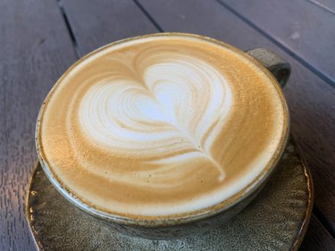 Latte with a heart design in the milk froth