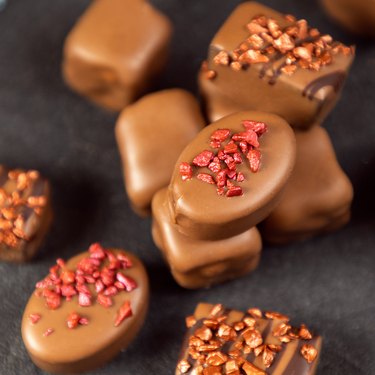 Close-up of tasty chocolates on black background