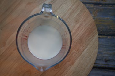 Milk in a glass measuring jug