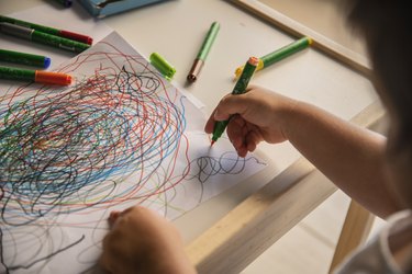 Kid drawing abstract colorful on white paper. Kids school education
