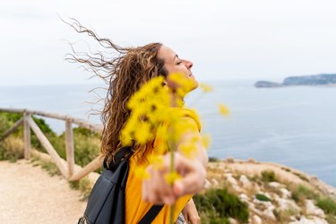 Panoramic view of woman in yellow on holidays.