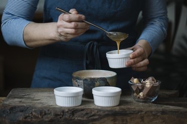 Woman preparing dessert, partial view