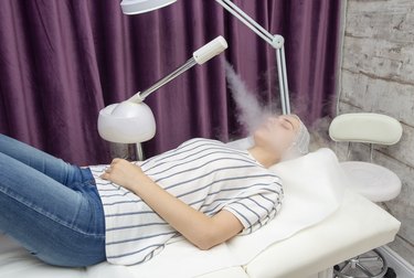 Beauty treatment of young female face, ozone facial steamer