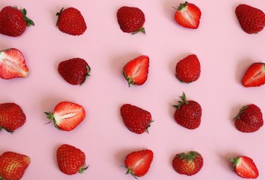 Strawberry pattern over pink background