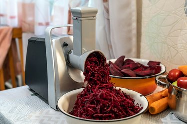 Cooking vegetable salad with an electric grater