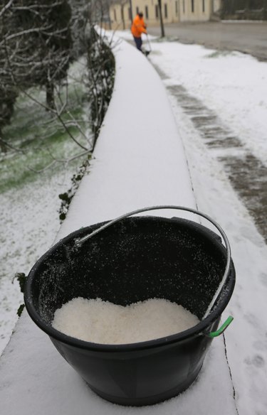 bucket with salt to melt ice from the sidewalk