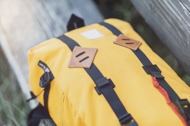 Yellow backpack, lashing strap, close up