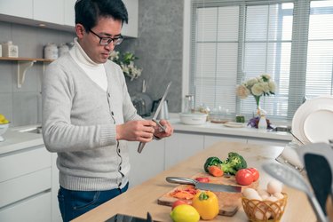 Asian man cooking in the kitchen