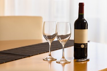 Delicious red wine and a glass to drink on an elegant holiday