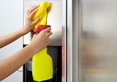 Adding polish to exterior of stainless steel refrigerator for cleaning