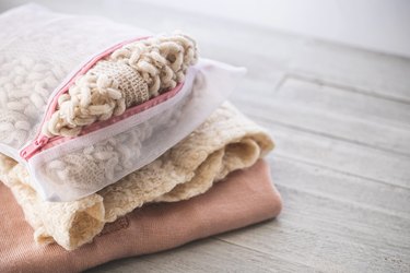 Sweaters and knits in the laundry net.