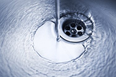 Sink drain with water