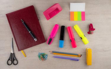 Various stationery on the light table surface