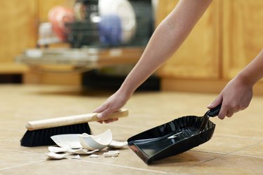 Woman Sweeping Broken Cup