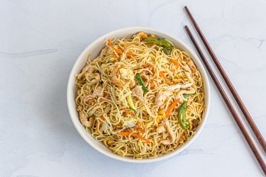 Wok Tossed Chicken Noodles with Chopsticks Top Down Asian Food Photo