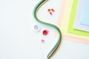 Close-up of curled paper on a white background, quilling