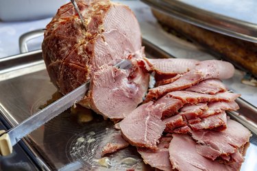 Slicing roasted ham