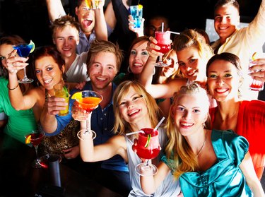 Group of people enjoying cocktails in a bar