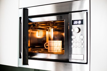 A mug inside a microwave oven