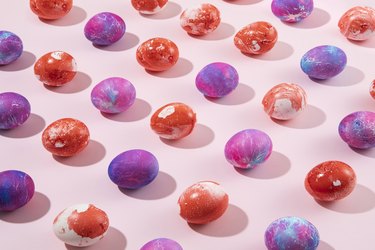 Colorful Easter Eggs in a Row on Pink  Background