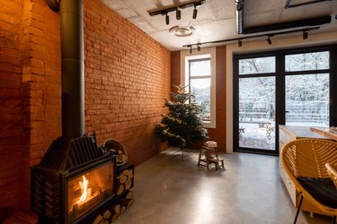 Cozy living room interior with Christmas tree and fireplace