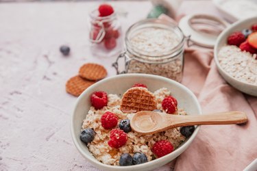 Oatmeal porridge with berries, healthy food.