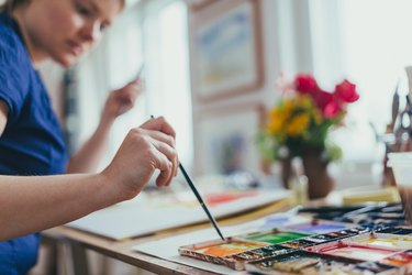 Woman painting watercolour.