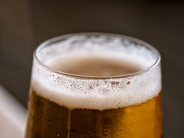Close up of a pint of cold beer served in a glass.