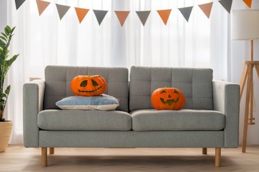 Carving pumpkin on the sofa